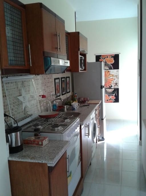 Kitchen with all appliances and clothes washer.