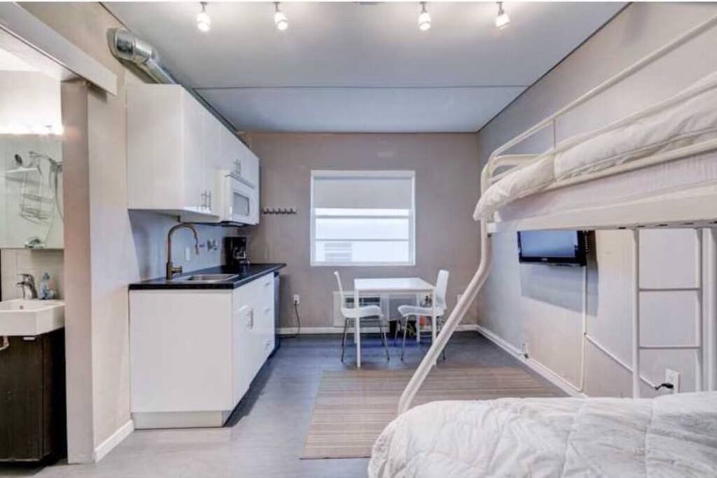 Bedroom with 1 full size bed 54x75 on the bottom and 1 twin bed 39X75 on top .