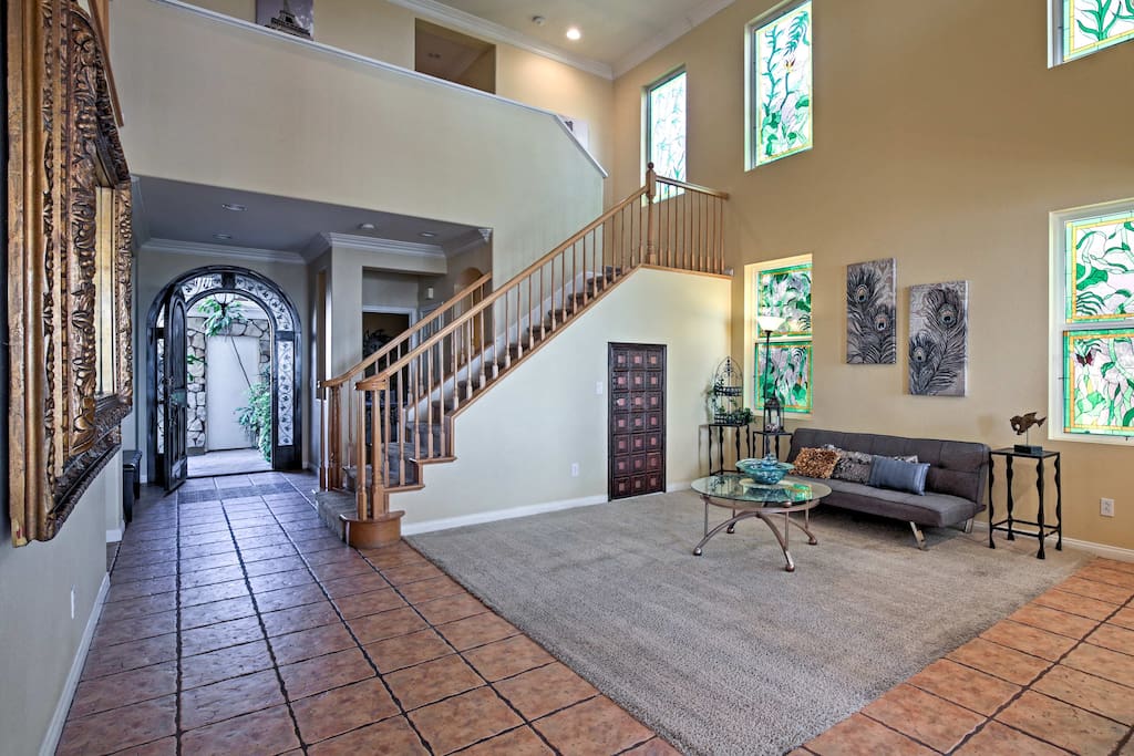 The 3,100 square feet of tasteful living space offers red tiling, plentiful natural light, and elegant decor.