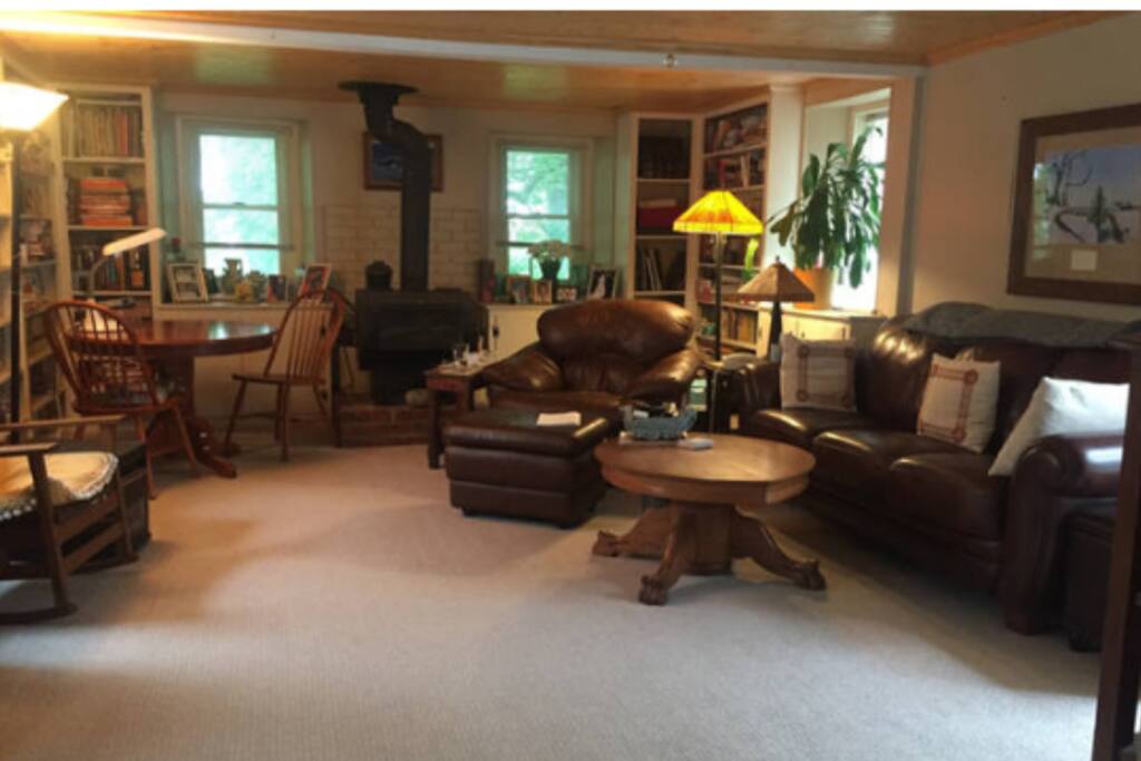 Living room with Plasma TV/ Cable, and a puzzle table.