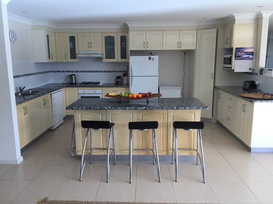 Fully equipped kitchen with breakfast bar.