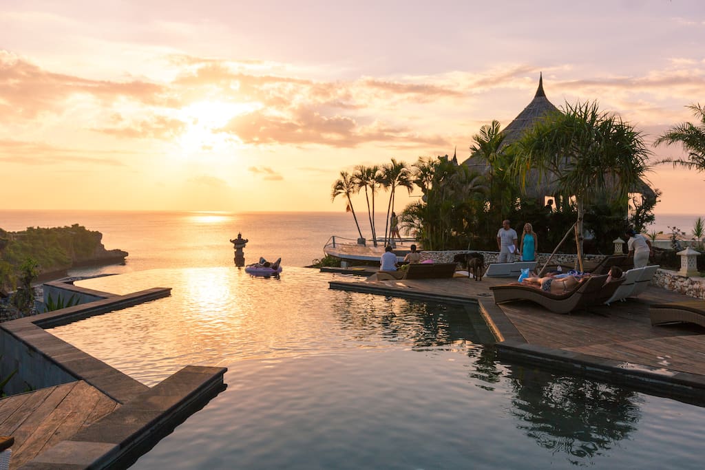 Three-tier honeycomb infinity pool during sunset. Hear the ocean waves below.