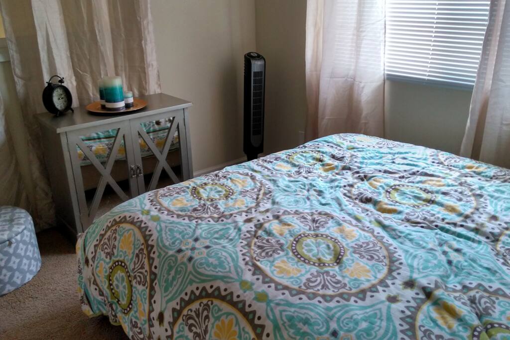 Some space for belongings, a small ottoman, and a closet