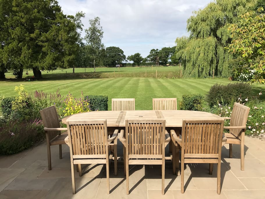 Alfresco dining overlooking the pond and fields