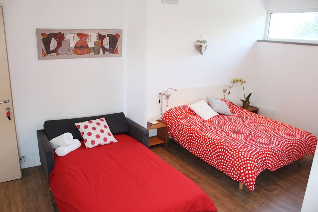 A double bed + sofa bed