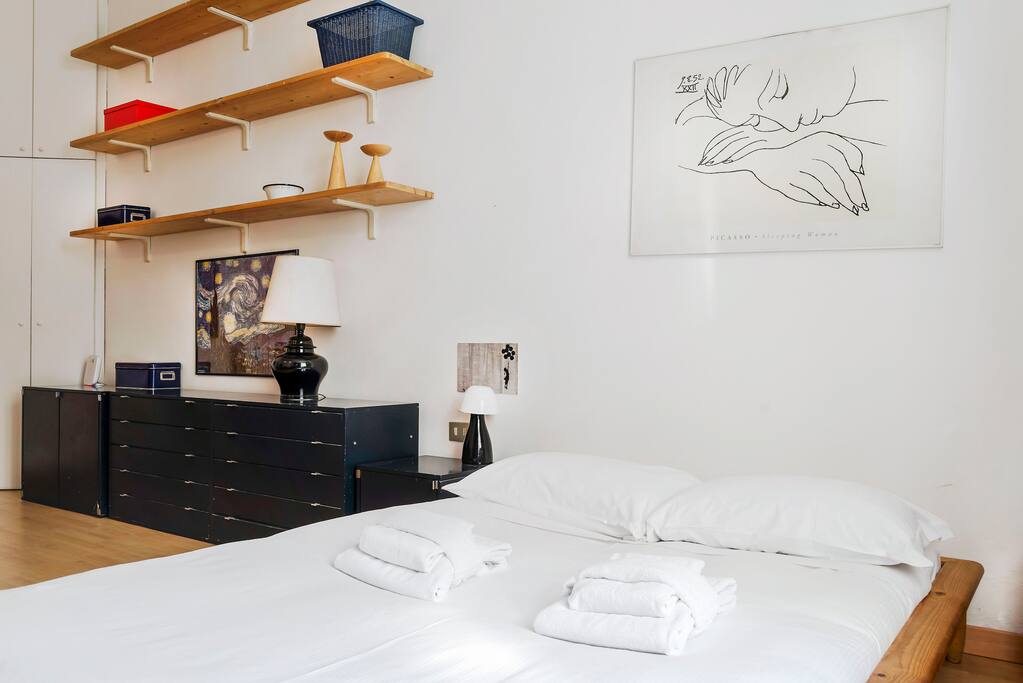 The Living area - The comfortable double bed with soft bed-linen and towels