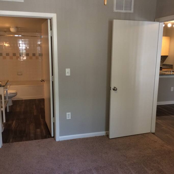Hallway to bathroom and room