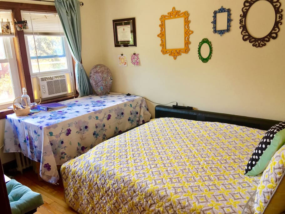 The chair (with blue cushion) in the lower left of the picture can be pulled over to the desk if you don't want to work from the bed/couch.