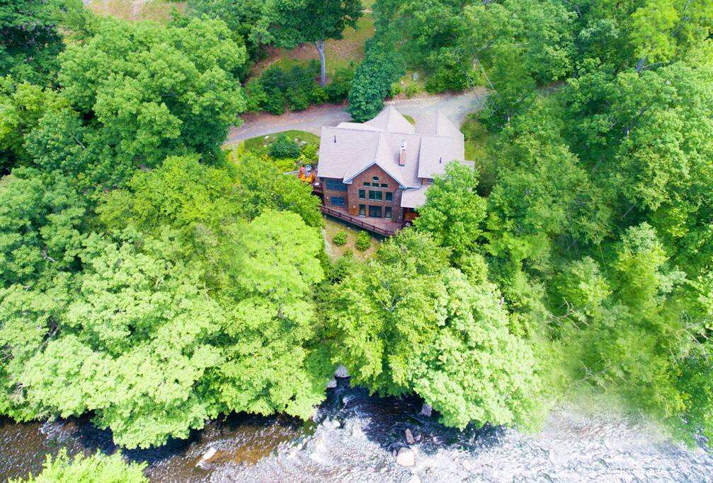 Aerial shot of home on river