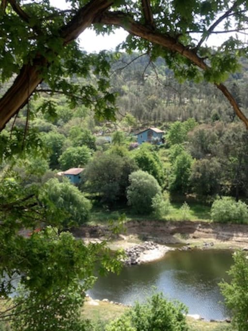 View of guesthouse taken from the opposite bank (lower left hand property).