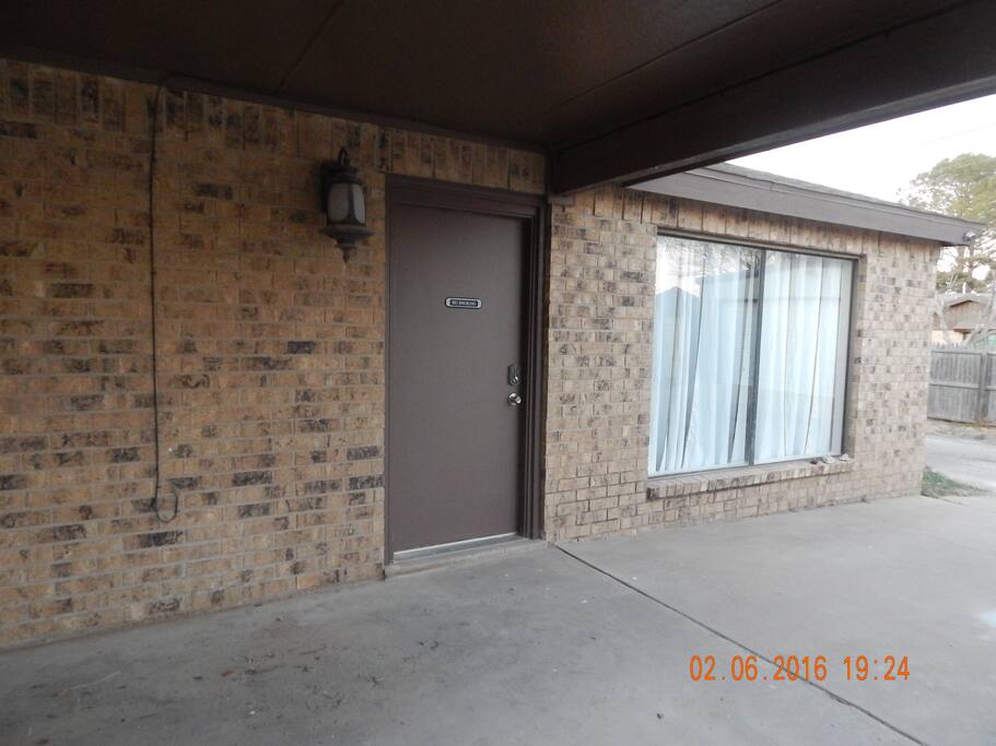 Front door under covered parking