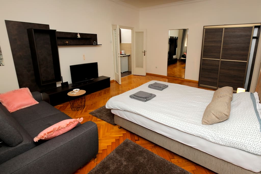 Bedroom 1 - big room with a brand new queen size bed and comfortable sitting sofa