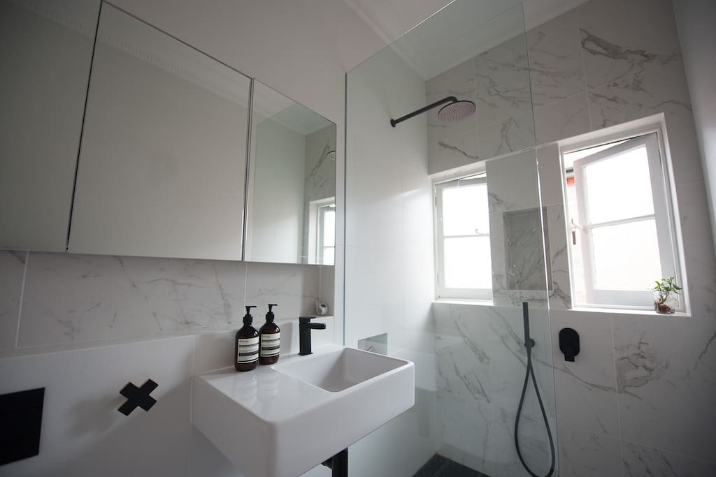A newly renovated bathroom with amazing rain shower head - there is a big hot water heater, perfect for long showers!