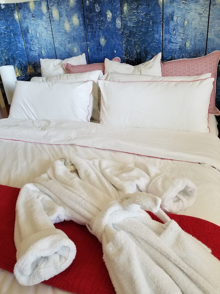 California King Bed with Egyptian cotton linens;  we provide cotton robes