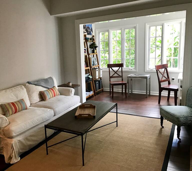 warm light in main living room and study overlooking adorable walking court.