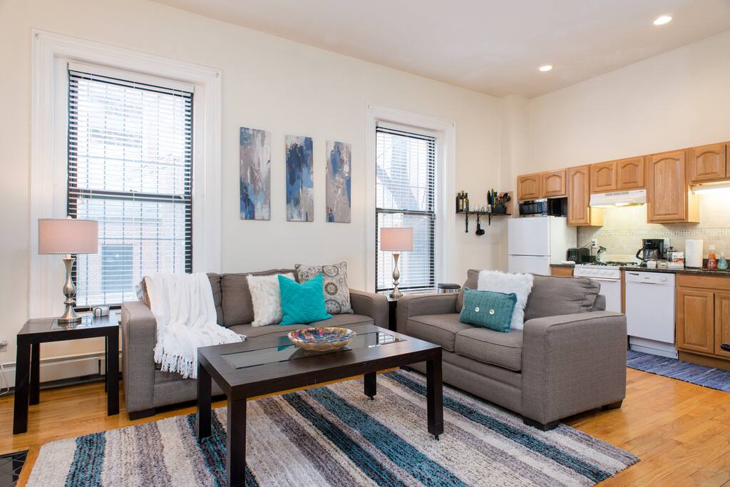 Our open concept living room and kitchen boasts high ceilings and large bay windows.