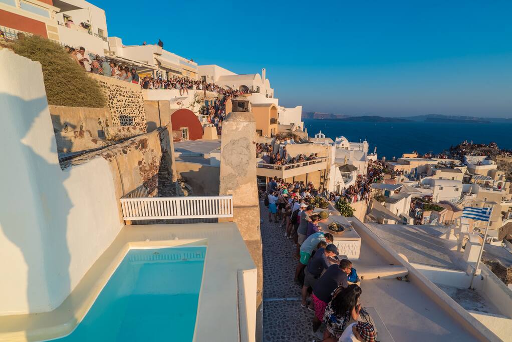 heated pool with Kaldera and sunset view