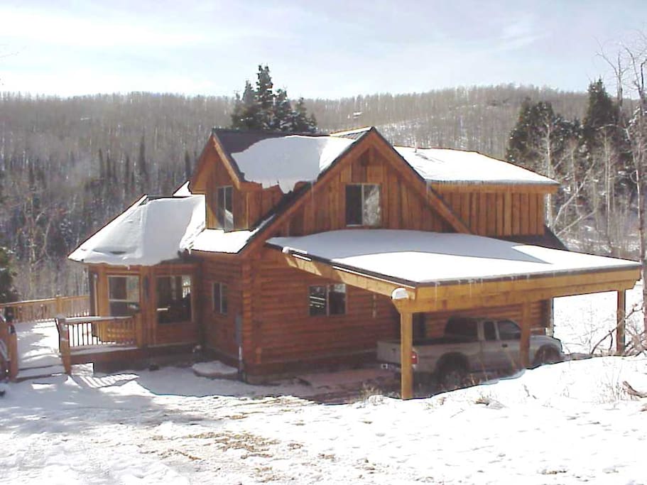 Outside of the cabin in the winter (carport no longer attached to cabin).