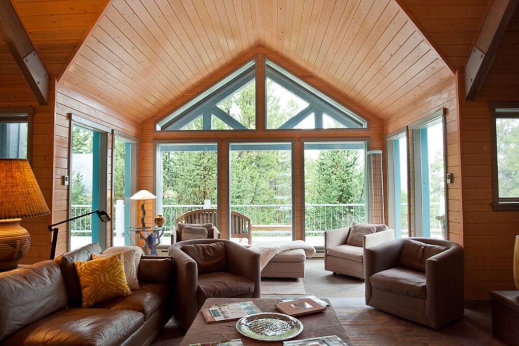 Forget Me Not Lane`s beautiful great room with vaulted ceilings and stone hearth.