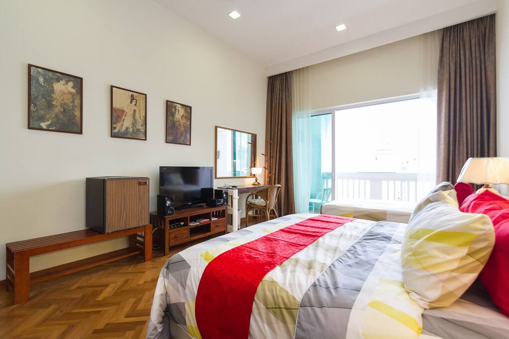 The master bedroom opens to a long lanai overlooking the marina and sea
