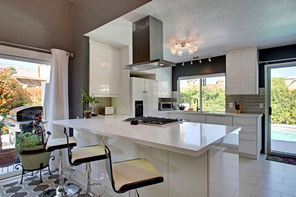 There is bar seating for 3 in the bright kitchen