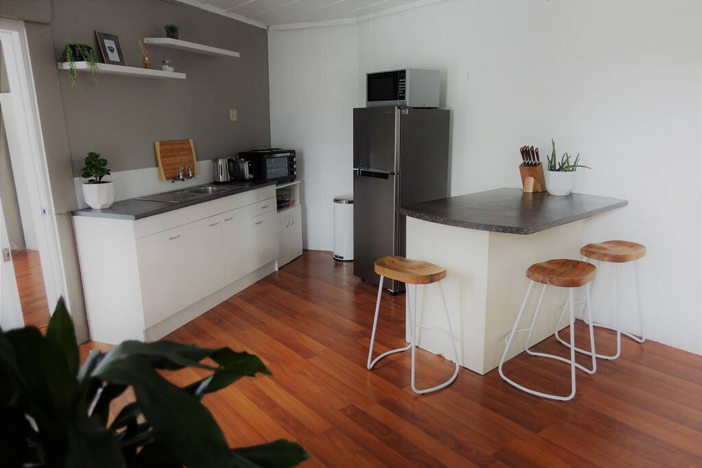 Kitchenette with small oven and bar leaner