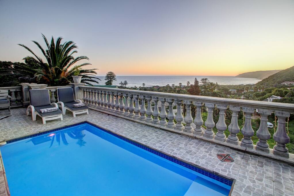 Swimming pool at dawn... splash pool with sun panels