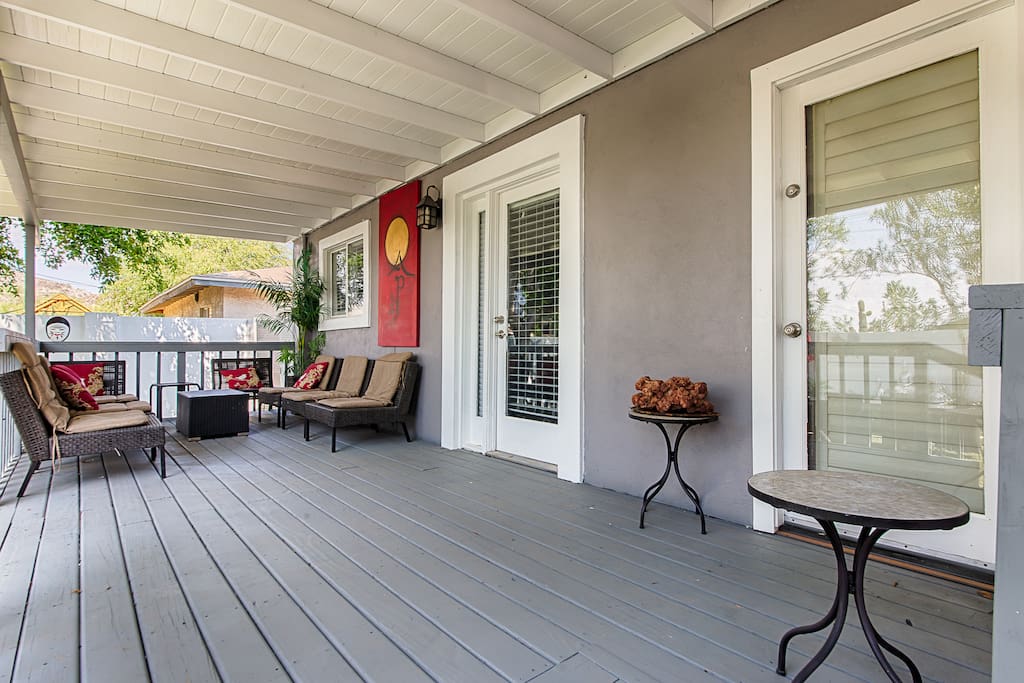 It has a big wooden deck overlooking the garden with lots of space to sit and relax