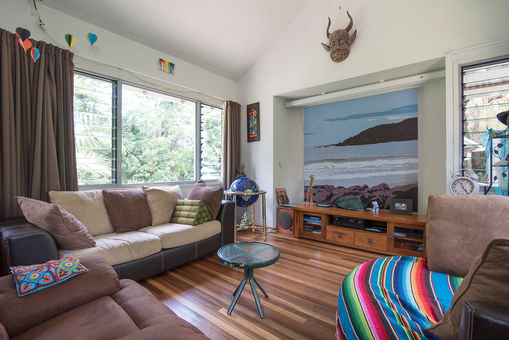 Open Plan living room with projection screen home theatre.