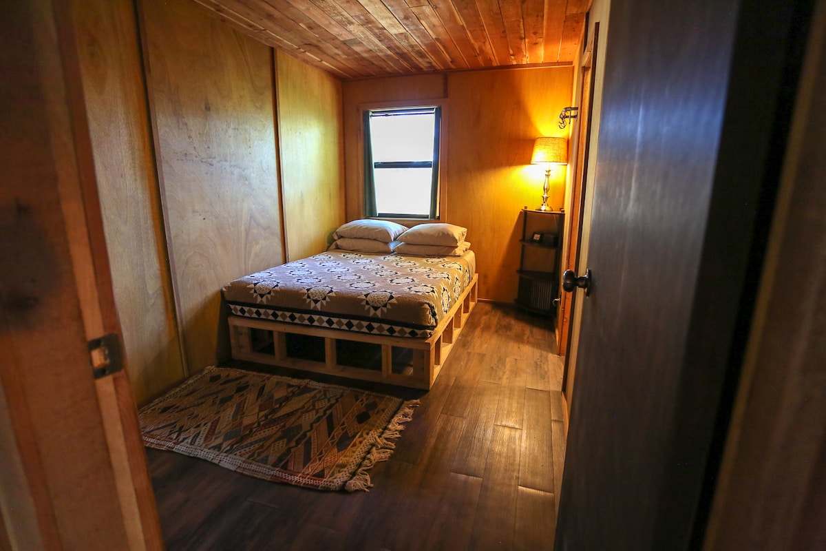 Queen bed in main bedroom, with adjoining private bathroom