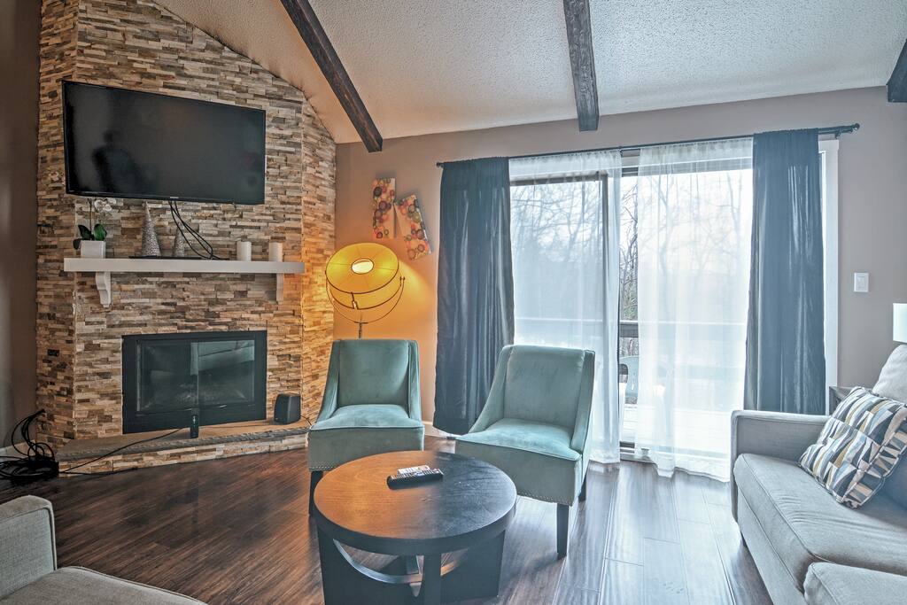 Curl up on the sofa to watch your favorite cable shows on the flat-screen TV.