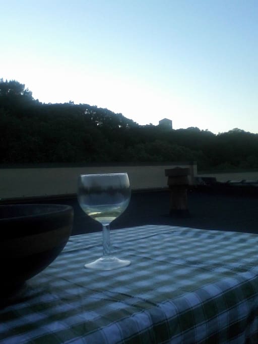 eating on the roof in NYC - Cloisters a bit visible in background