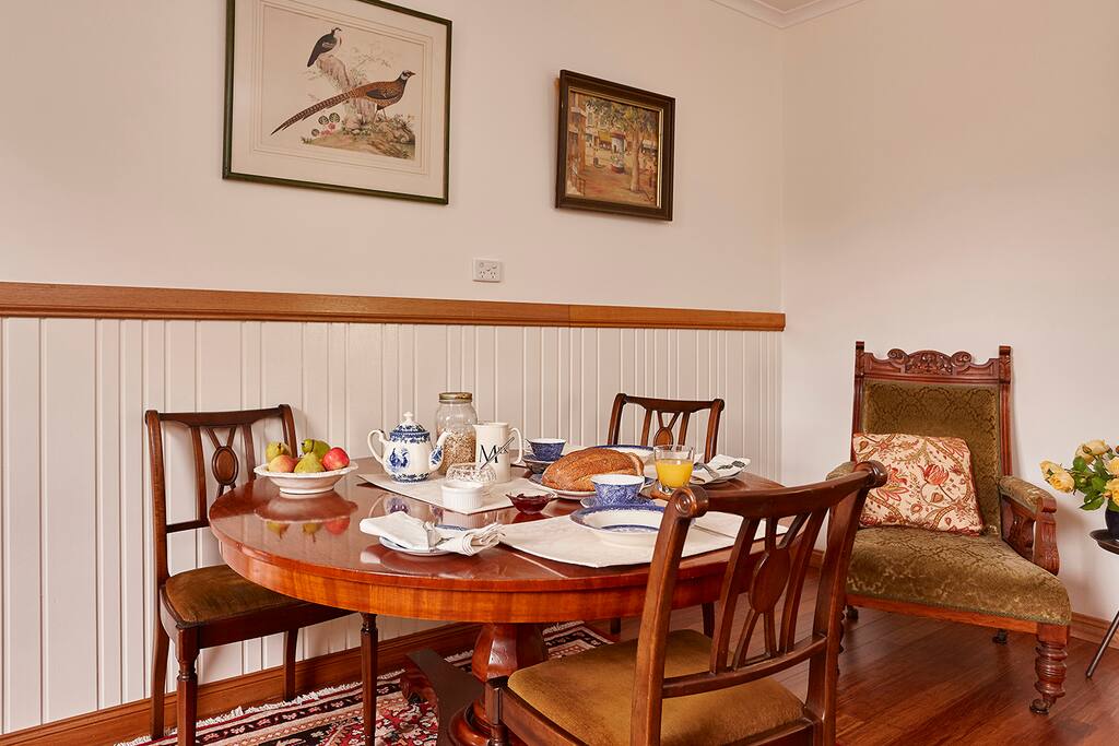 Colonial cedar dining table set for breakfast.