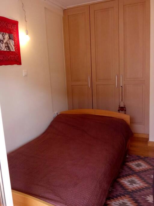 Room A2: bed and small office with balcony.