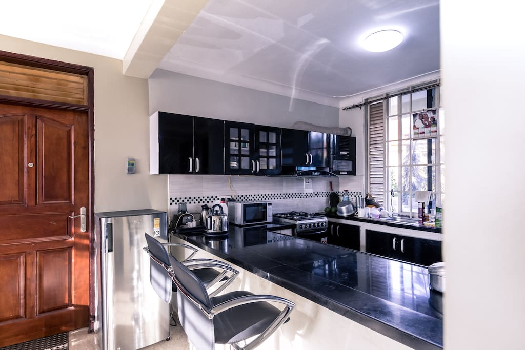 Kitchen: The coolest thing about the kitchen is not that it's wide and american, It is the multi purpose work top.