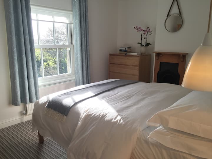 Light airy room with a 5ft double bed. East facing so wake up to the morning sunshine and a great day ahead, but lovely and cool for a mid afternoon nap!