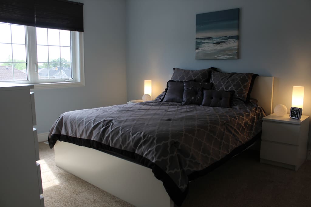 Queen Bed in large, bright upper bedroom in new home