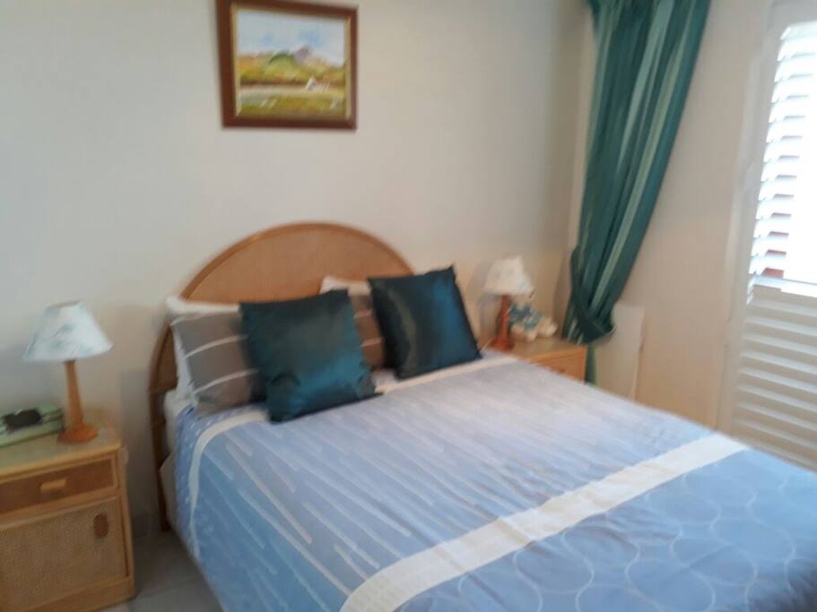 Main bedroom with doors to balcony