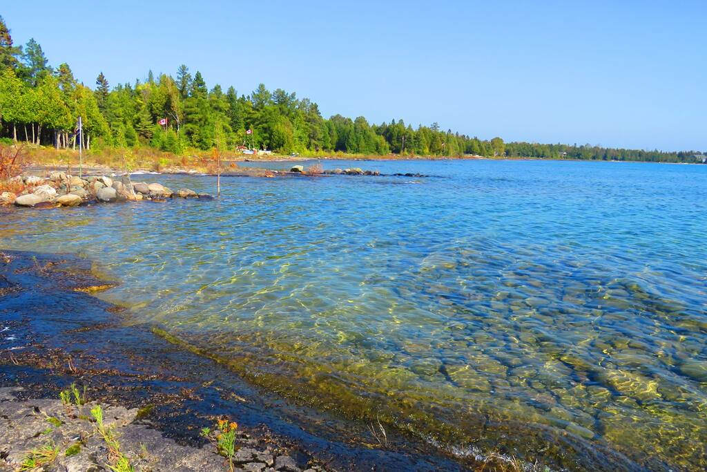 Private beach with crystal clear water.