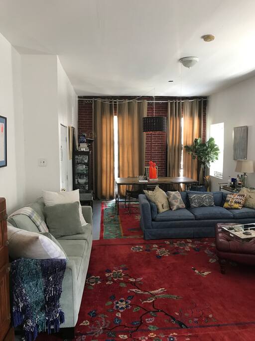 Living room and dining room - great open space, very comfortable. Green couch is a sofa bed.
