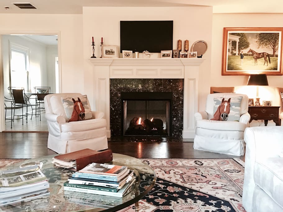 Family room with double sided fireplace shared with kitchen.