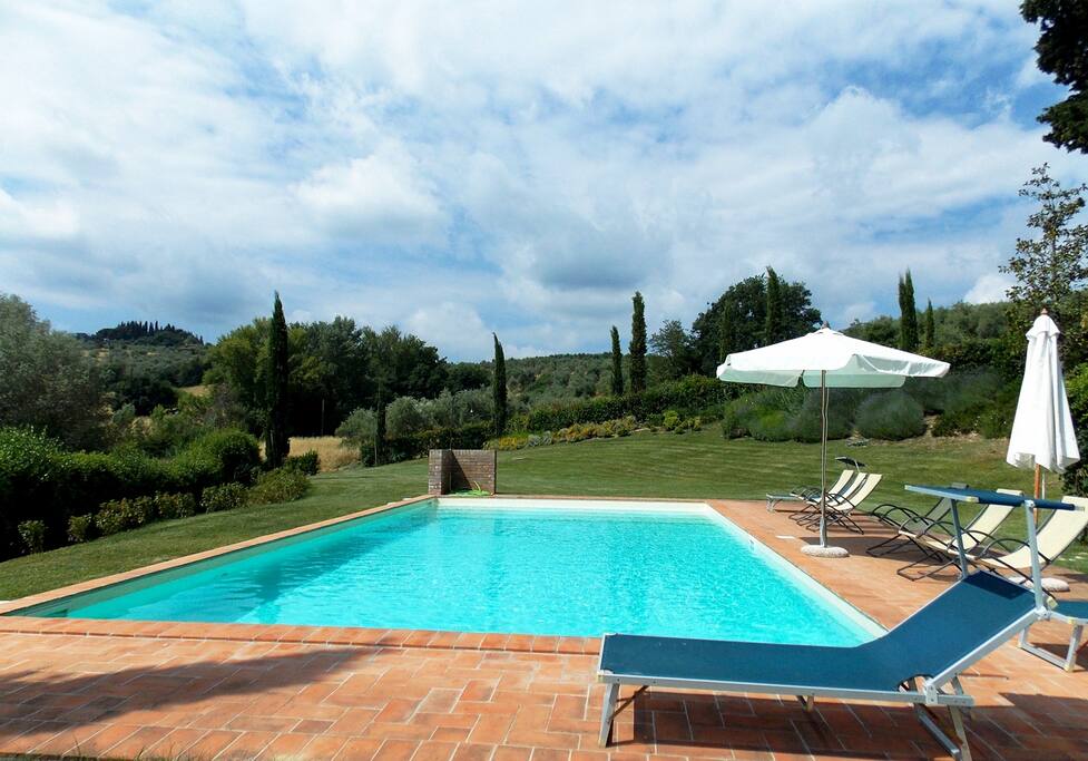 Swimming pool with paved bathing area