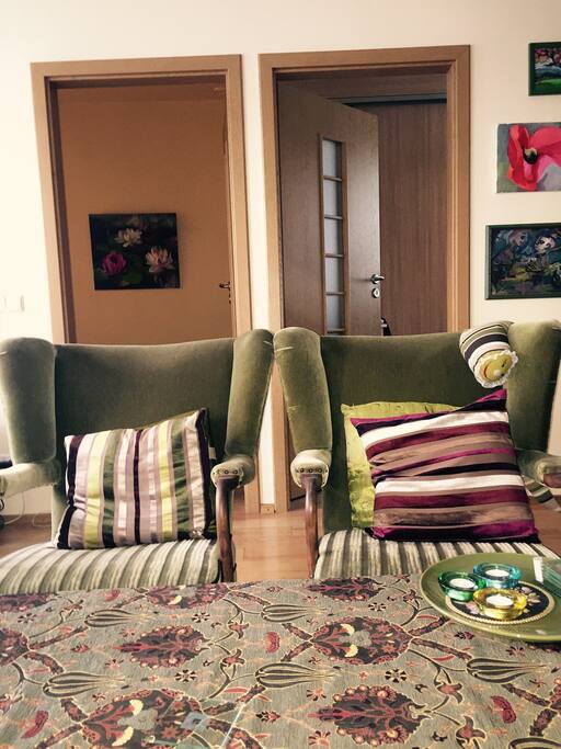 on a sofa:) and doors to the bedroom and another room:)
