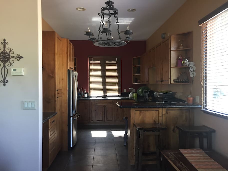 Kitchen with full amenities. Full size refrigerator and freezer, stove, oven, sink, coffee maker, blender, toaster, pots and pans.