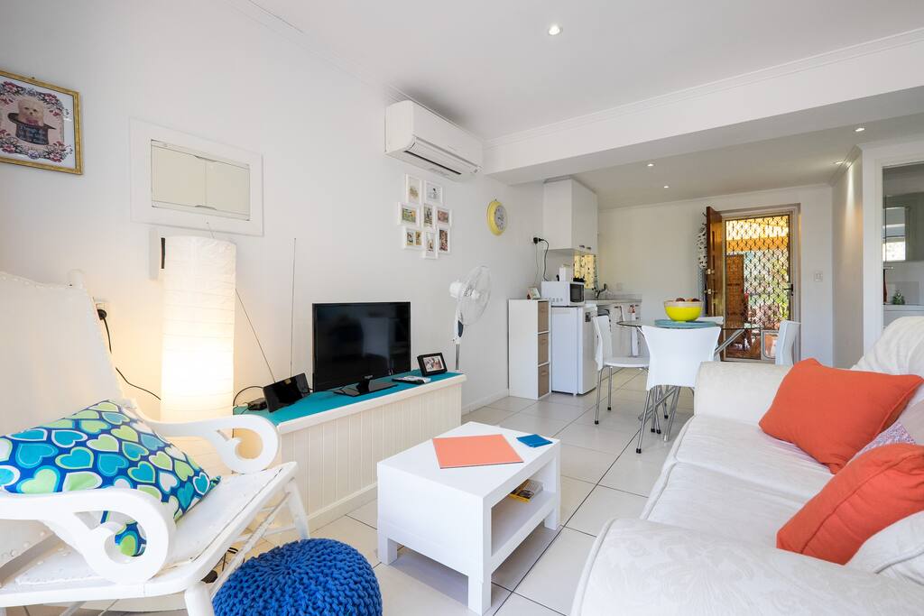 Comfy lounge area with TV, DVD player, air conditioner and fan