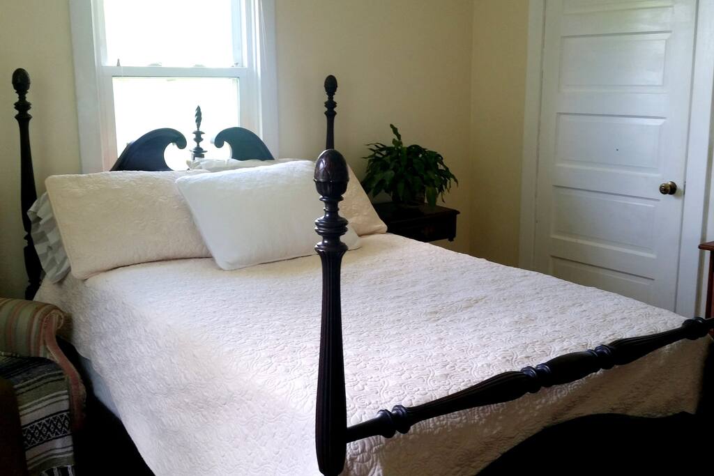 Your private room is a cozy upstairs spot with lots of natural light. Relax in your antique four-poster full bed.