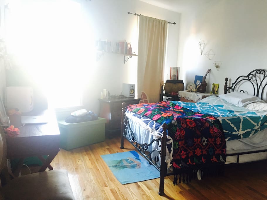 Spacious bedroom flooded with light