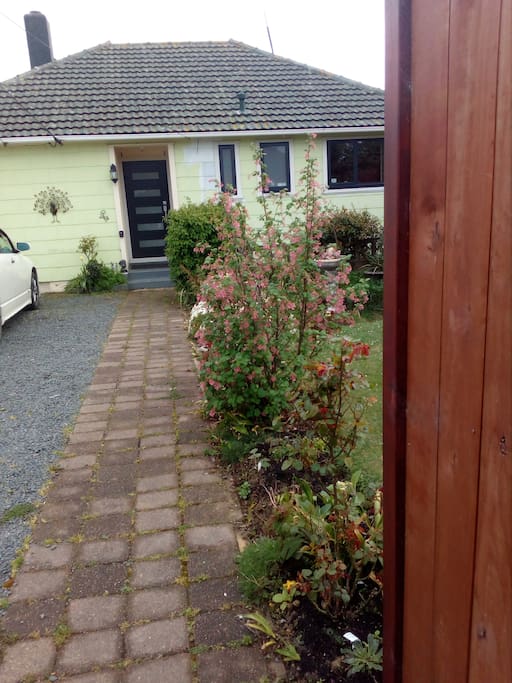 Flat easy access from the street, and driveway which is to the left of this photo. (Flat being not the norm in Dunedin!!)