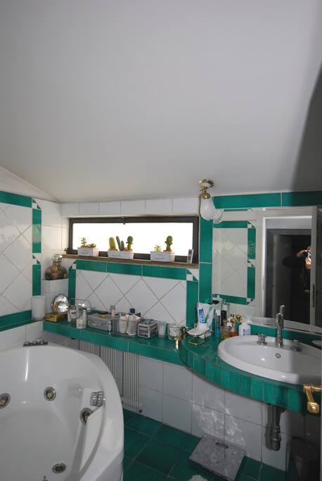 Bathroom with bathtub and shower