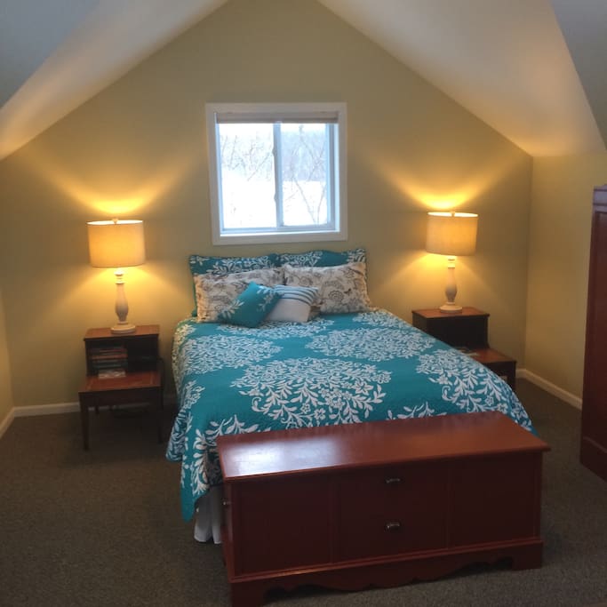 Upstairs, comfortable queen bed with space to relax.
